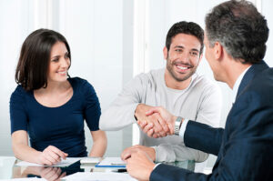 Couple Sitting with lawyer in Consultation